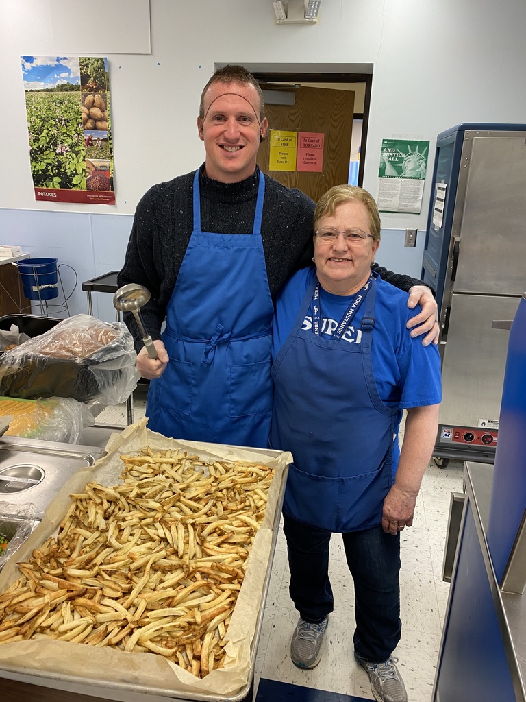 Principal Mr. Nelson and Nutrition Staff Sue with a tray of fresh french fries