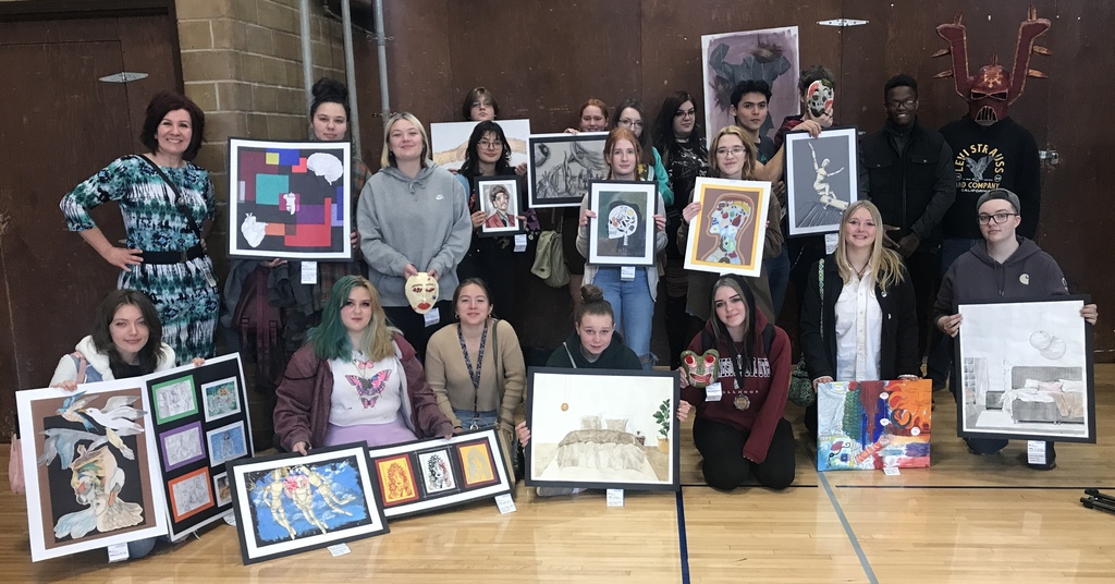 group photo of students holding they art entries