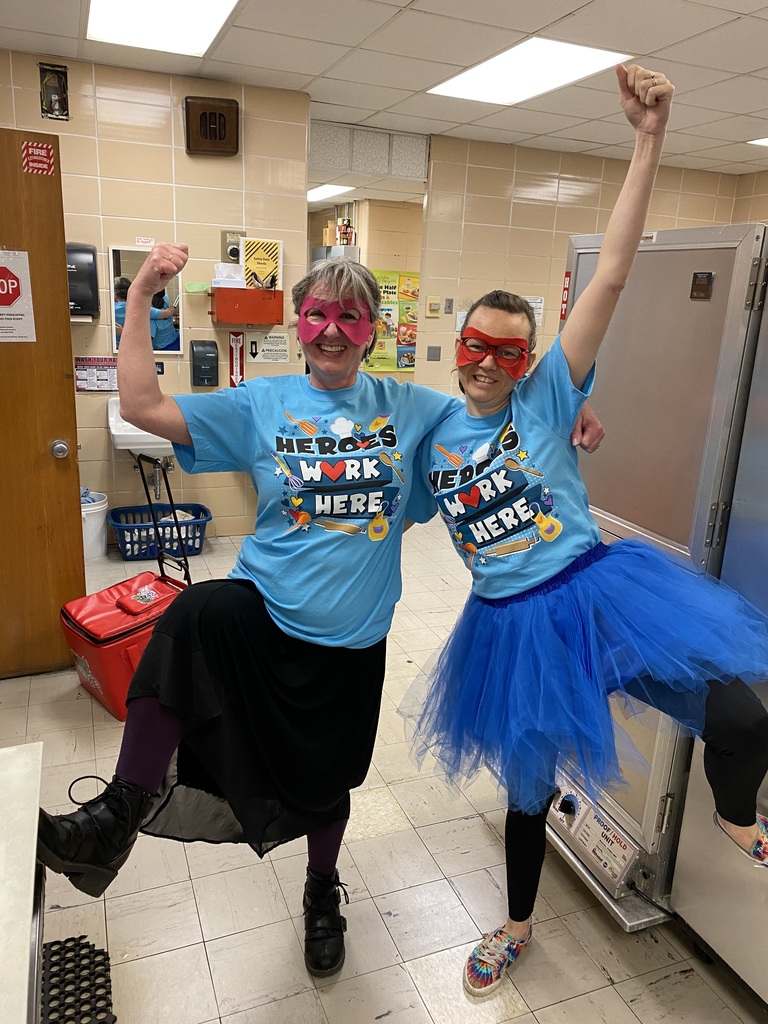 Nutrition staff with red super hero masks over their eyes and super hero t-shirts