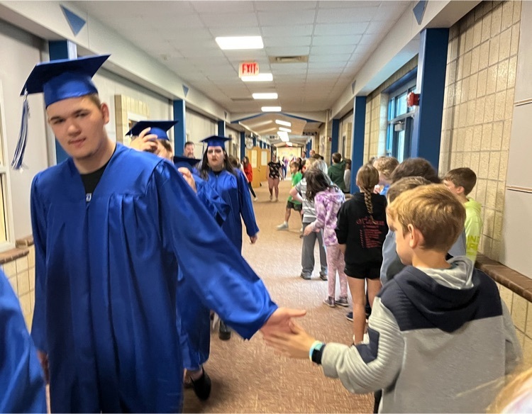 Mora graduates walk through  